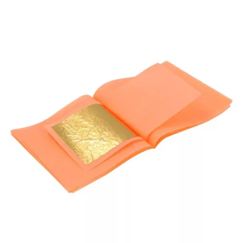 Ein orangenes Büchlein mit Blattgold in der Mitte auf weißen Hintergrund