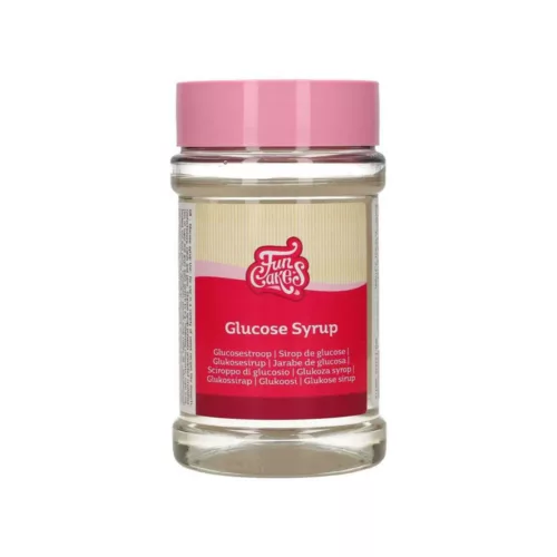 Ein durchsichtiges Glas gefüllt mit Glukosesirup.