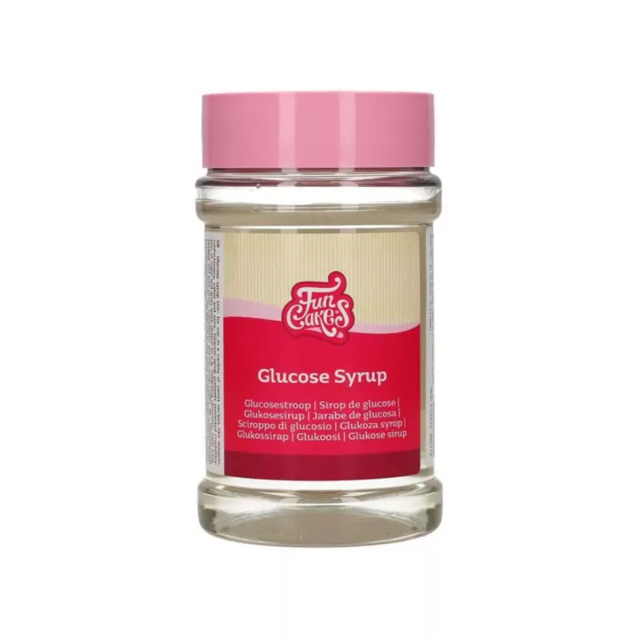 Ein durchsichtiges Glas gefüllt mit Glukosesirup.