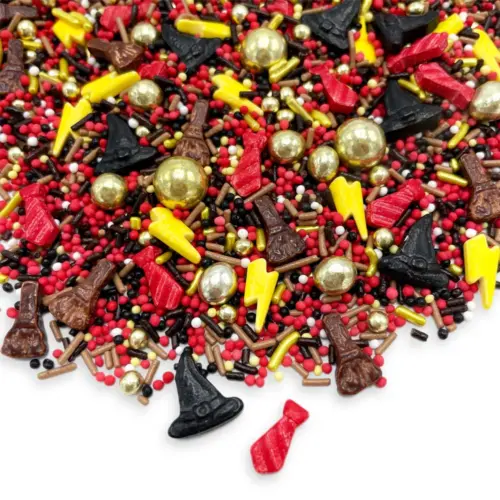 Verschiedene Streusel in Magic Motiven in den Farben gold, gelb, schwarz, braun, weiß und rot auf weißem Hintergrund