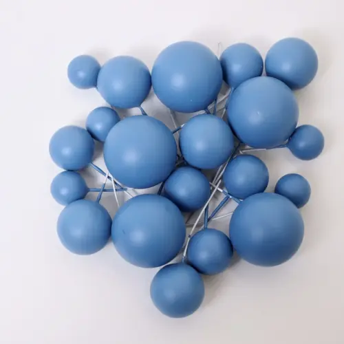 Mehrere matte blaue, runde Bubbles Kucheneinstecker in unterschiedlichen Größen