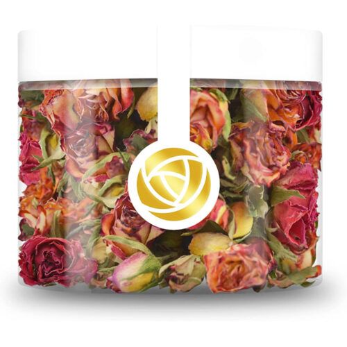 Getrocknete Rosenknospen in Rot, Orange und Gelb im transparenten Rosie Rose Tiegel mit weißem Deckel und goldenem Rosenlogo.
